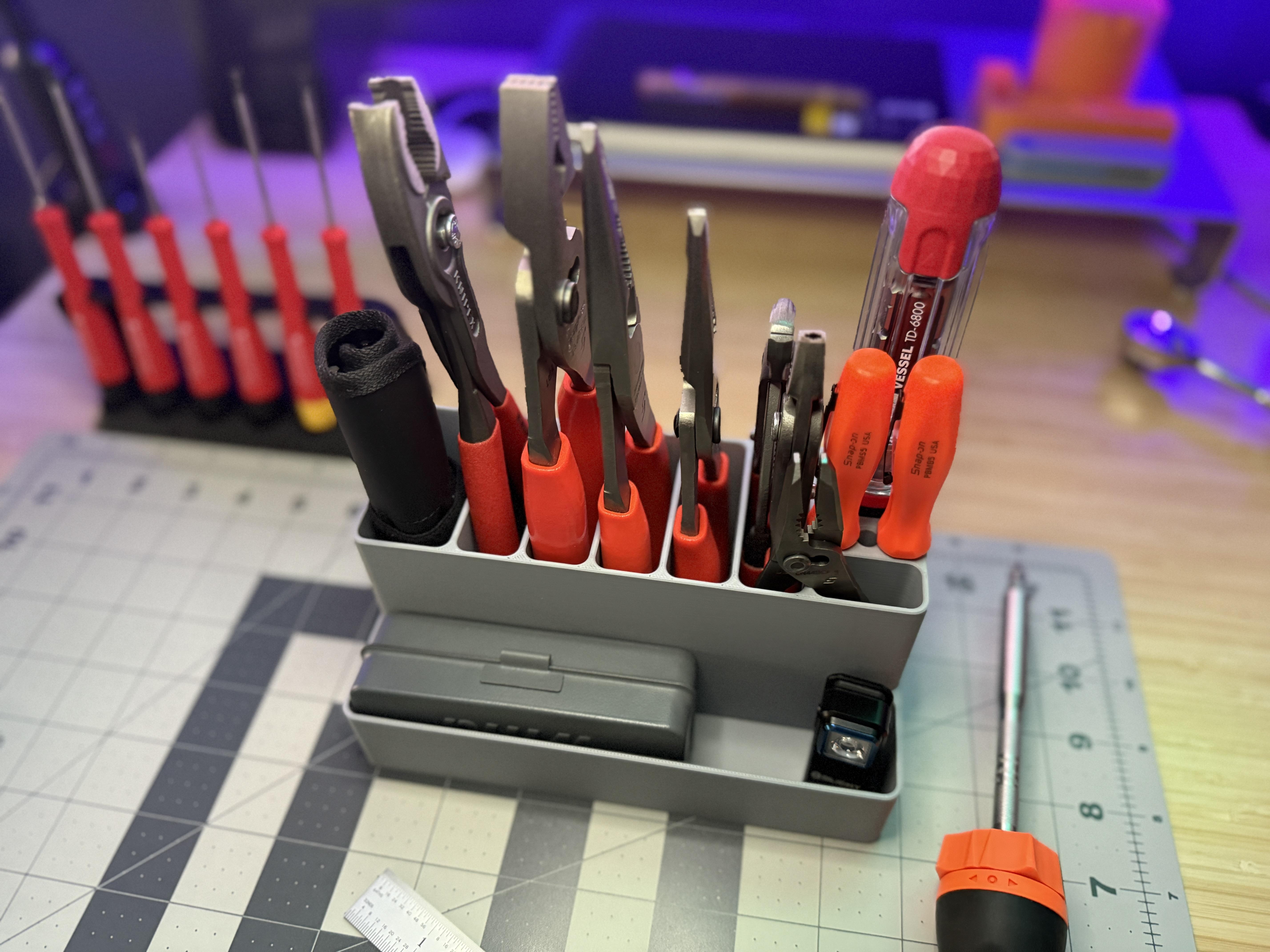 Engineer's workshop bench with organised tools in 3D printed organiser trays